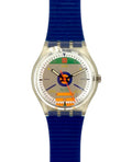 A Swizzlin' Swatches wristwatch featuring a bright blue textured silicone strap, a silver-tone case, and a colorful dial with a blue circular logo and orange accents.