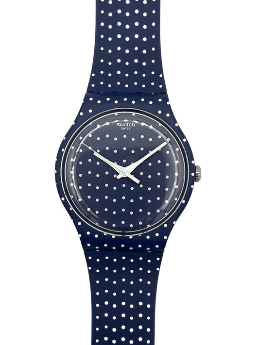 Navy blue watch with white polka dot pattern on a white background