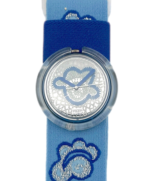 Watch with blue strap and silver design on a white background