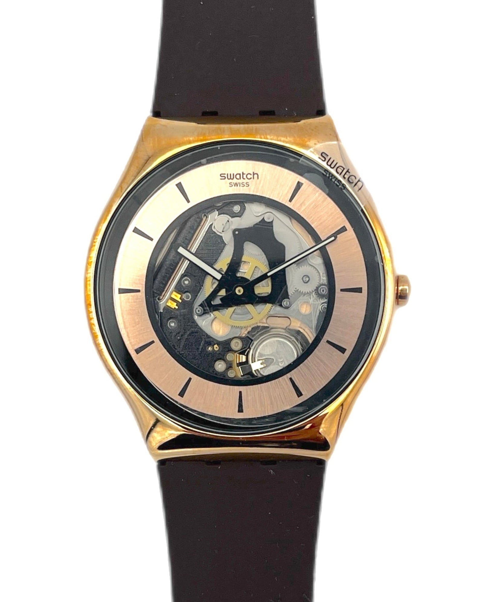 Swatch watch with black strap and gold case on a white background