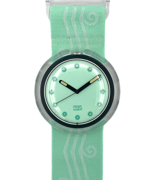 Swatch watch with a green strap and matching face on a white background