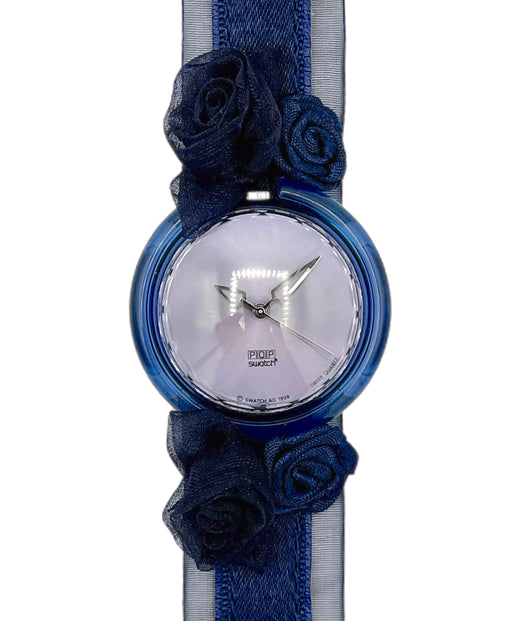 Wristwatch with blue floral straps on a white background
