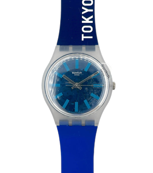 Blue Swatch watch with 'Tokyo 21' text on a white background