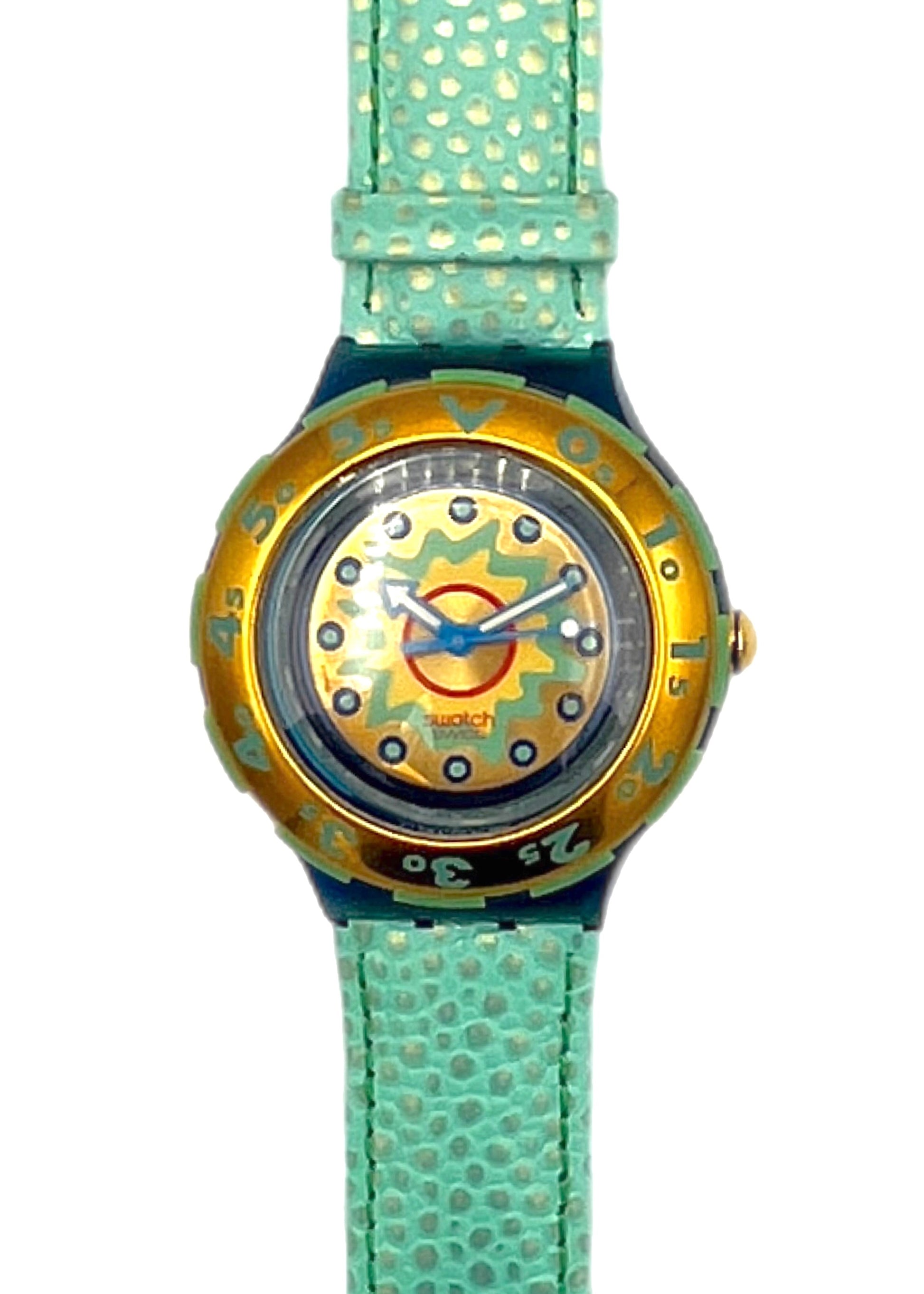 Watch with gold face and turquoise strap on a white background