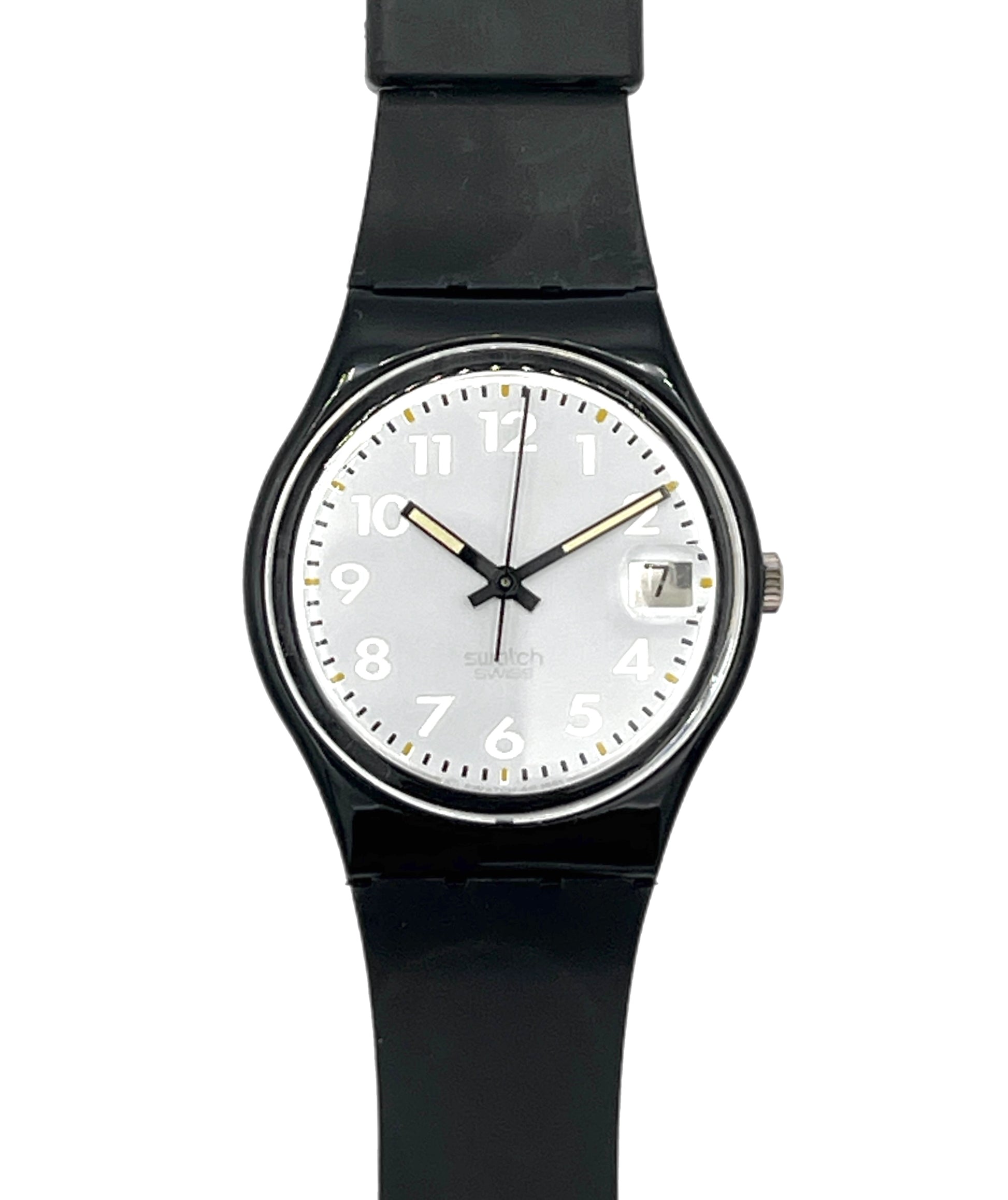 A Swatch wristwatch with a black round case, black strap, and a white dial featuring black Arabic numerals and gold-tone hands.