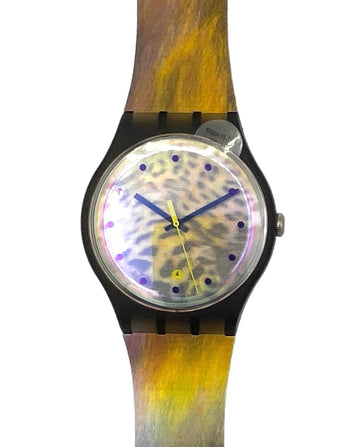 A wristwatch with a black case and a strap featuring a yellow, gold, and brown wood-grain pattern, set against a plain white background.