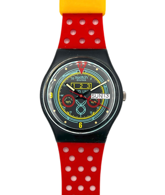 Colorful Swatch watch with a red polka dot strap on a white background
