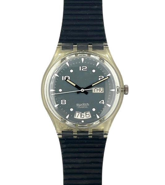 Swatch watch with black strap and clear case on a white background