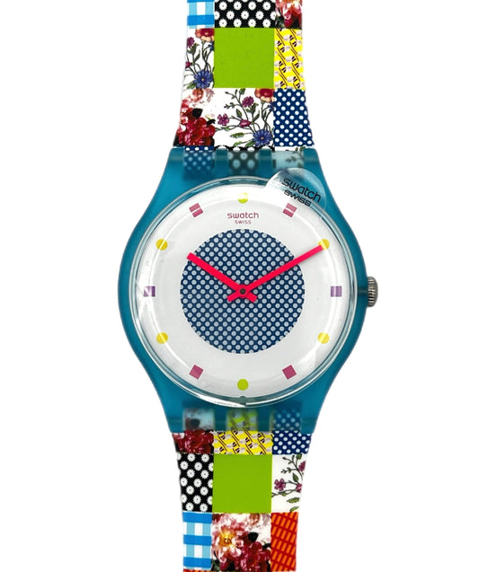 Colorful Swatch watch with a patterned strap on a white background