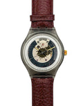 Watch with a brown leather strap and visible mechanical components on a white background