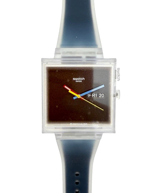 Swatch square analog watch with a translucent dark blue silicone strap and a clear plastic case housing a dark brown dial with colorful hands.