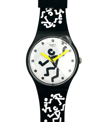 Swatch watch with black strap and white dial featuring black abstract designs on a white background